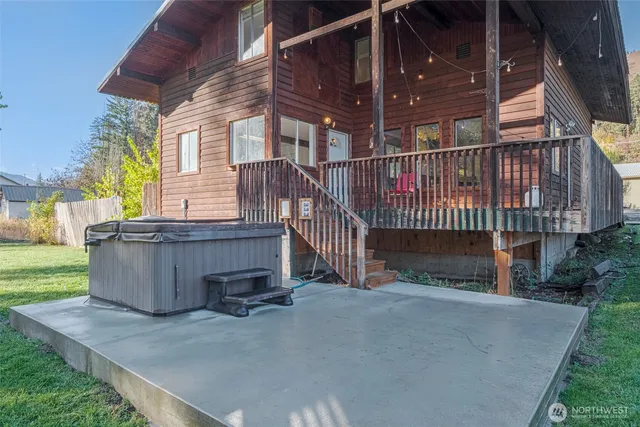 a view of a house with a wooden deck