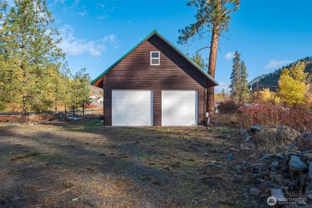 a kitchen with a refrigerator and a table