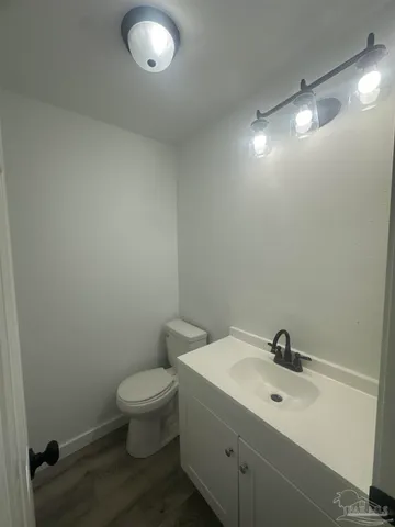 a kitchen with granite countertop a sink and cabinets