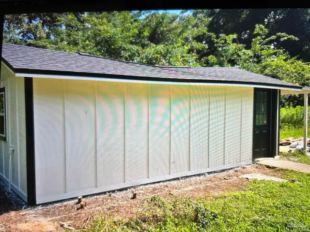a view of backyard with green space