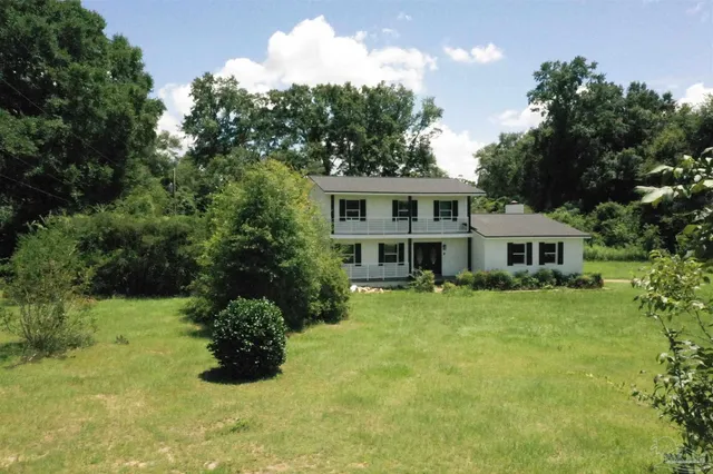 a house view with a garden space