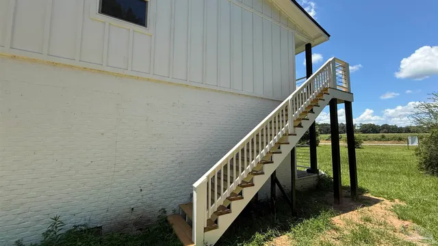 a view of front of house with a yard