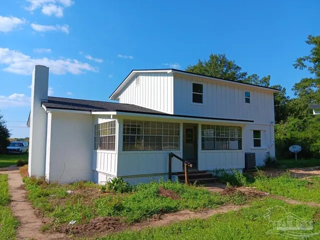 a view of a livingroom with a staircase