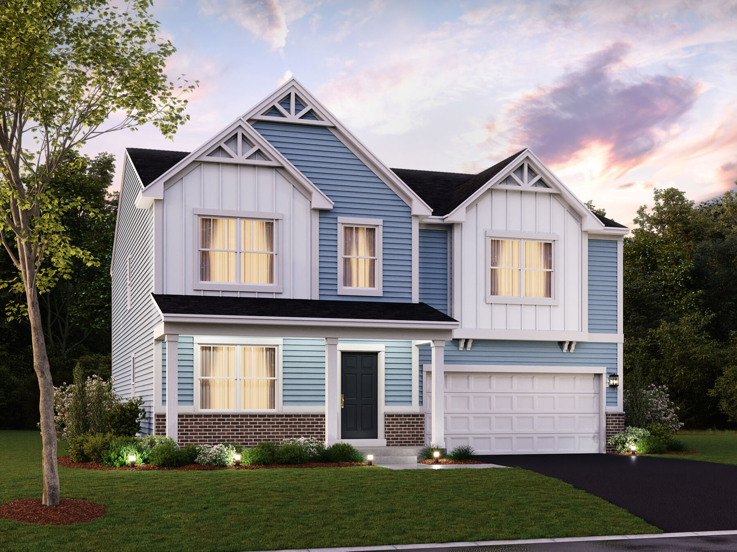 a front view of a house with a yard and garage