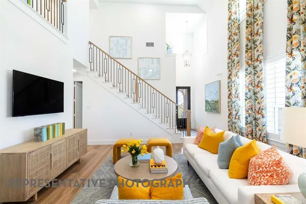 a living room with furniture and a flat screen tv