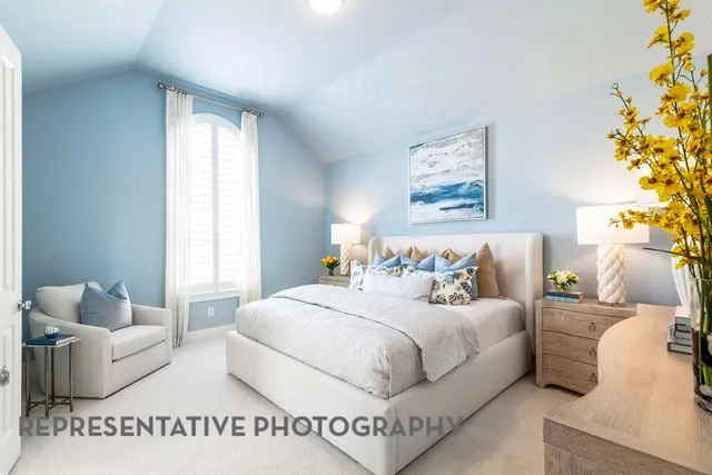 a bedroom with a bed and a couch