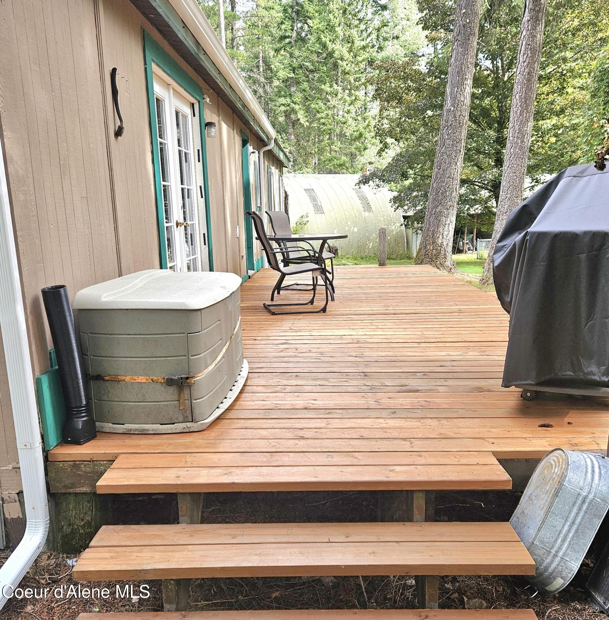 13118 Hellroaring Road Athol, ID 83801 - Photo 24 of 44 New deck & gutters 8/23