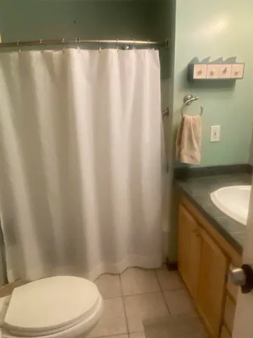 a bathroom with a toilet and a sink