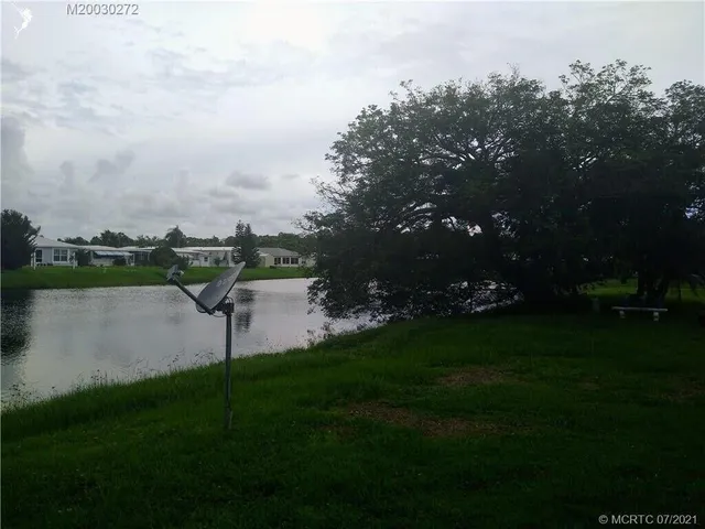 a view of a lake with a garden