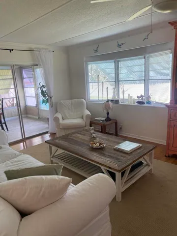 a living room with furniture and window