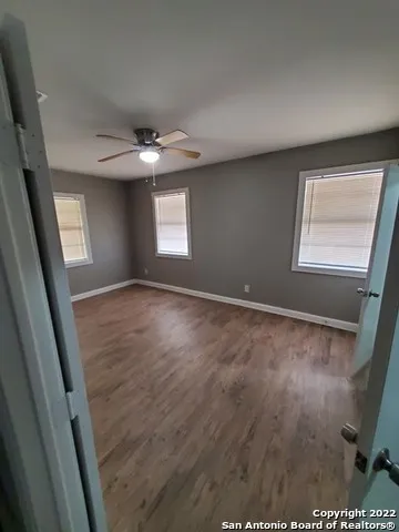 a bathroom with a bathtub sink mirror and toilet