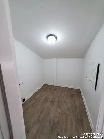 a bath tub sitting next to a white toilet