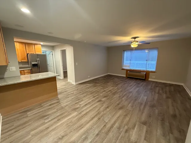 a view of a kitchen from the hallway