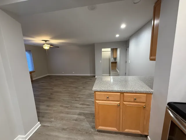 a bathroom with a granite countertop sink a vanity and a mirror
