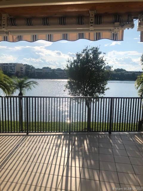 Stunning Lake views | Large tiled porch | Retractable electric awnings | Fence & wood stairs that take you down to the lake and the beautiful manicured grass area