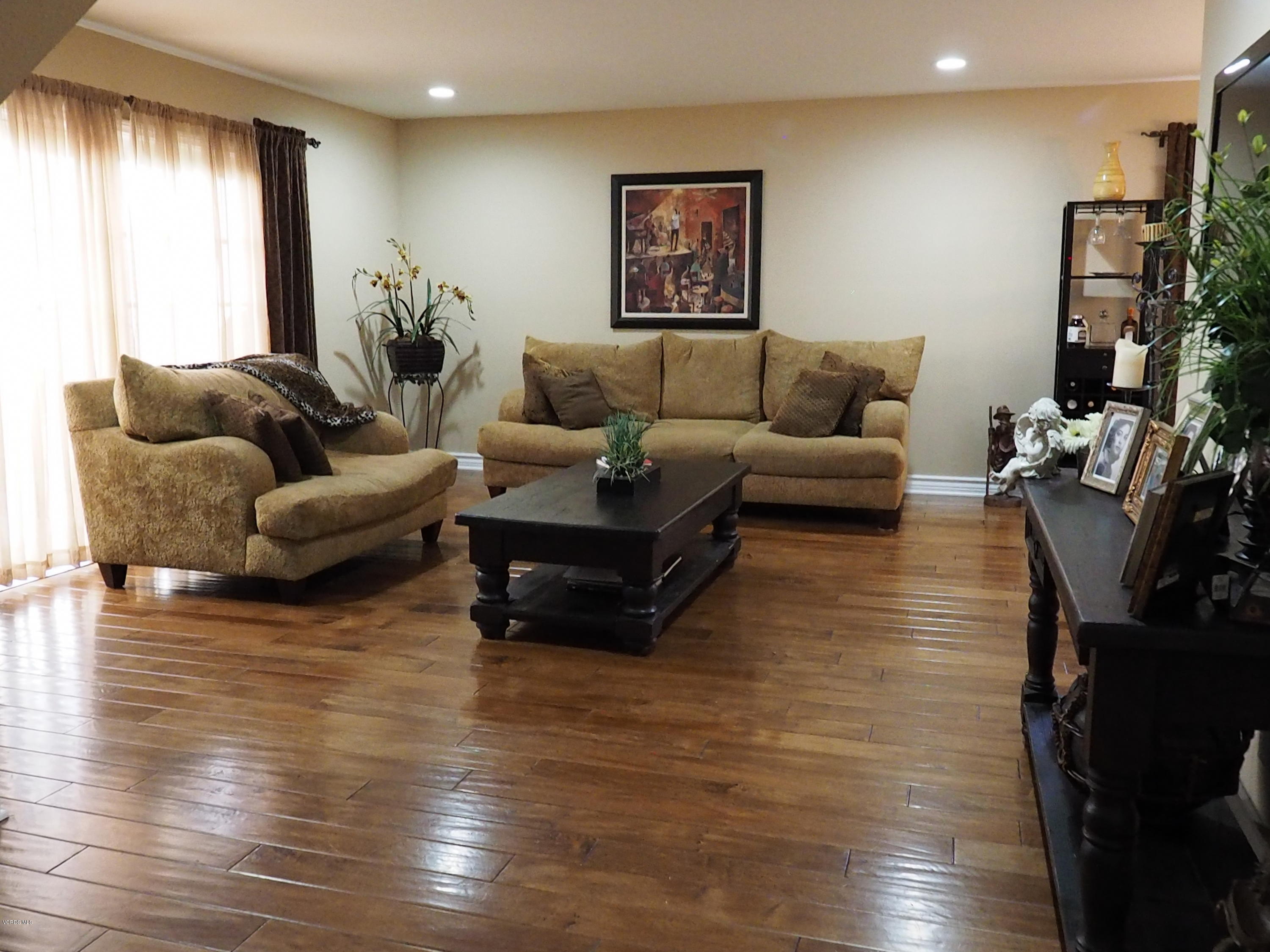 5727 Cochran Street Simi Valley, CA 93063 - Photo 12 of 43 a living room with furniture and wooden floor