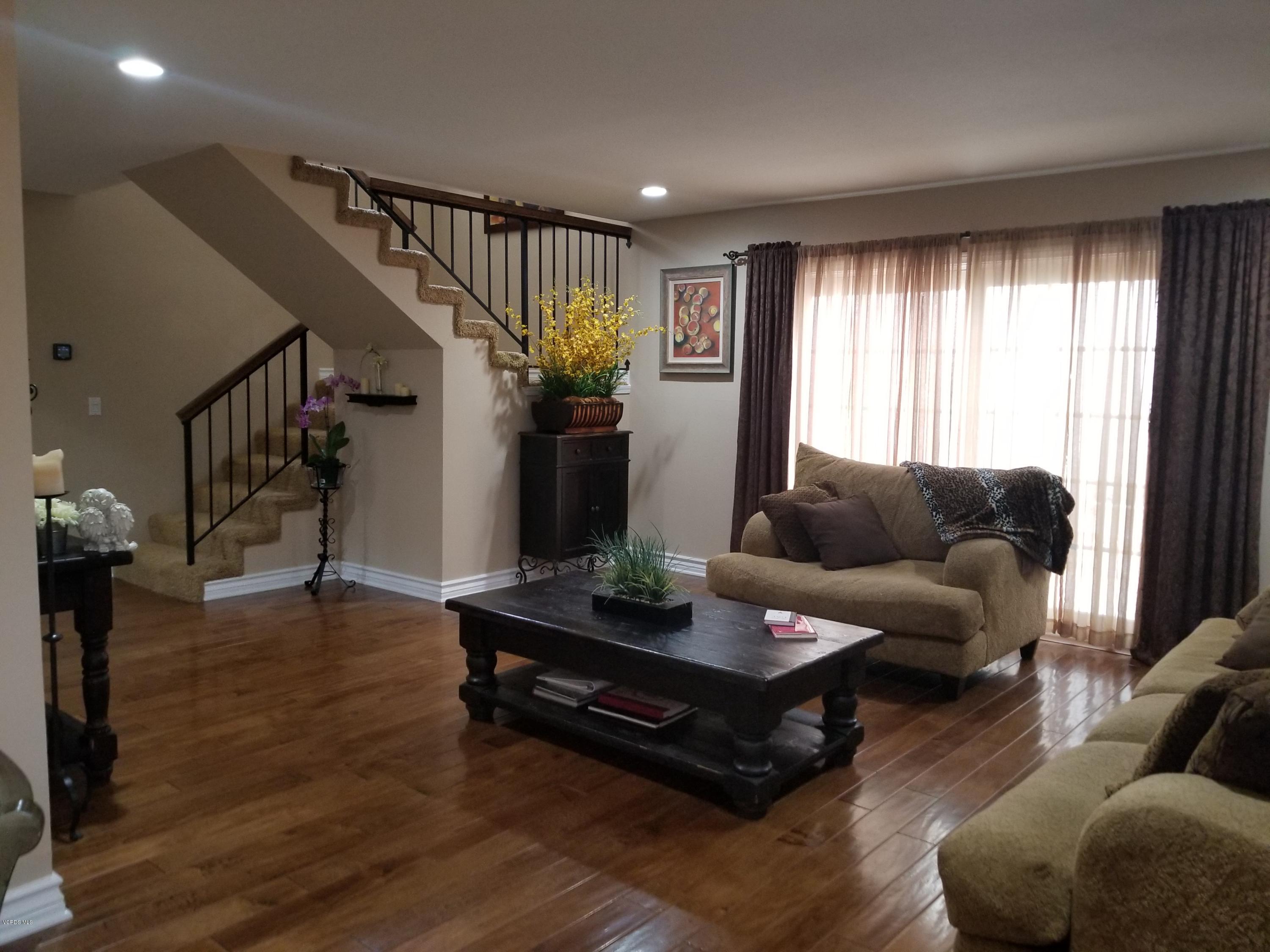 5727 Cochran Street Simi Valley, CA 93063 - Photo 13 of 43 a living room with furniture and a potted plant