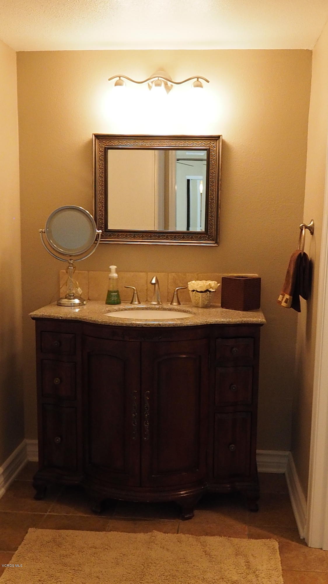 5727 Cochran Street Simi Valley, CA 93063 - Photo 20 of 43 a bathroom with a sink vanity and mirror