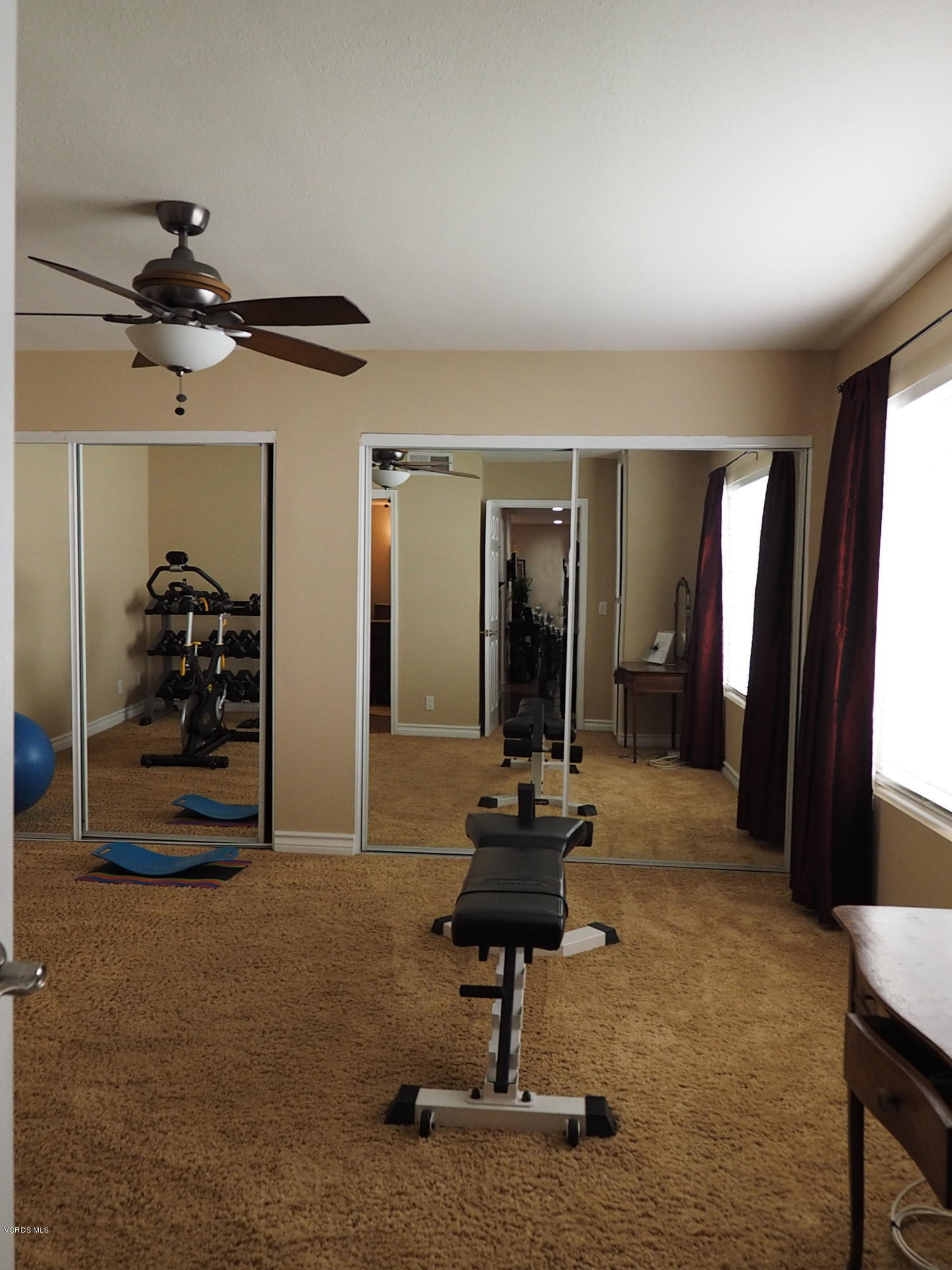 5727 Cochran Street Simi Valley, CA 93063 - Photo 23 of 43 a room with gym equipment and a large window