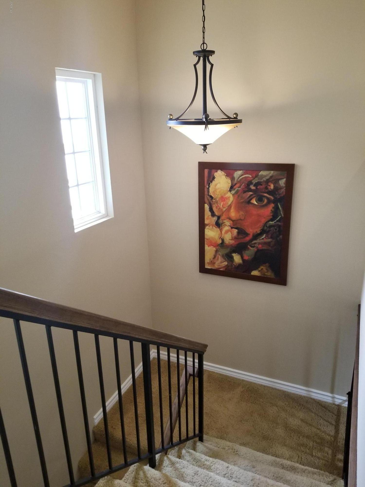 5727 Cochran Street Simi Valley, CA 93063 - Photo 26 of 43 a view of a hallway with a window