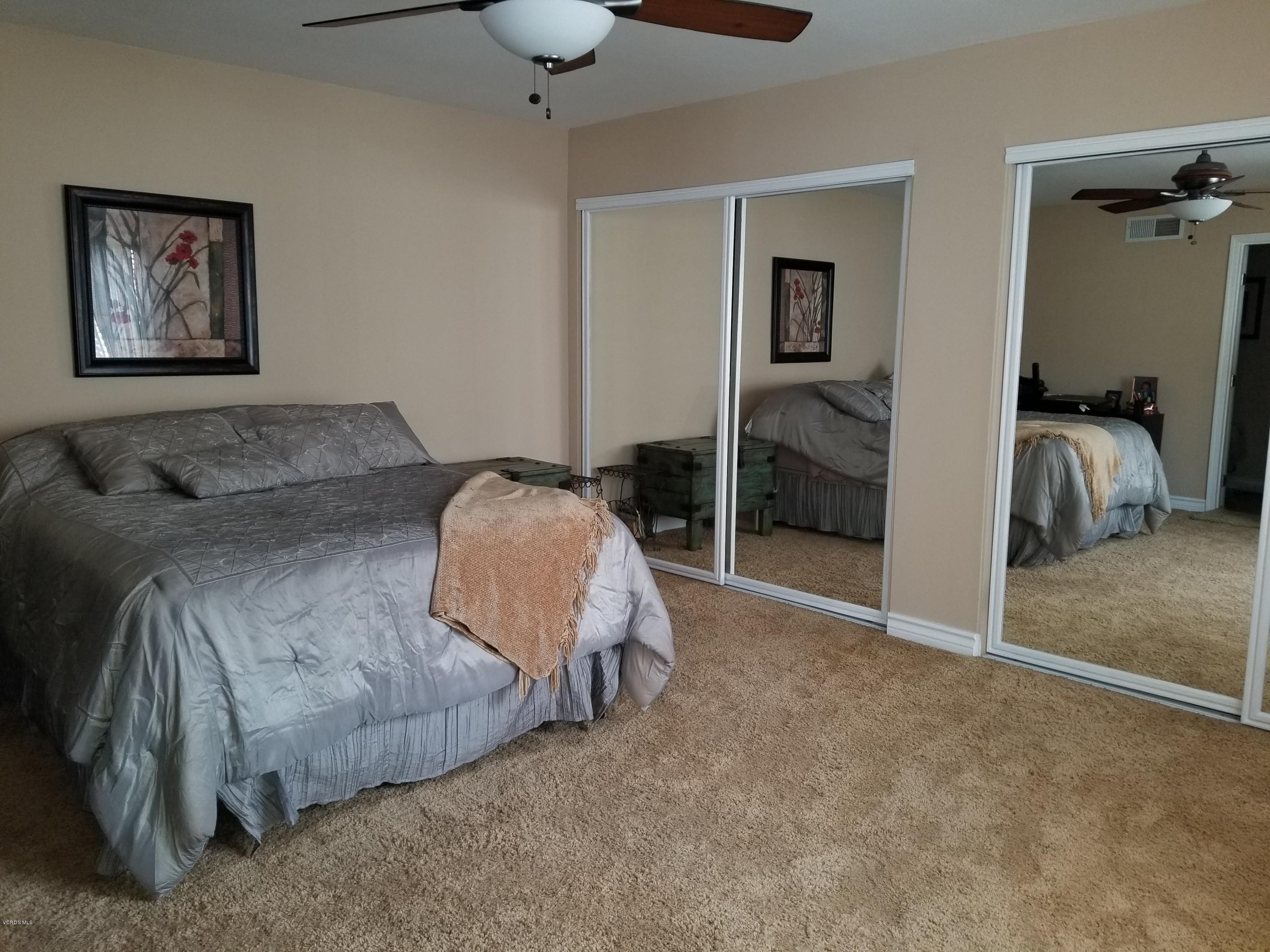 5727 Cochran Street Simi Valley, CA 93063 - Photo 33 of 43 a bedroom with a bed and a walk in closet