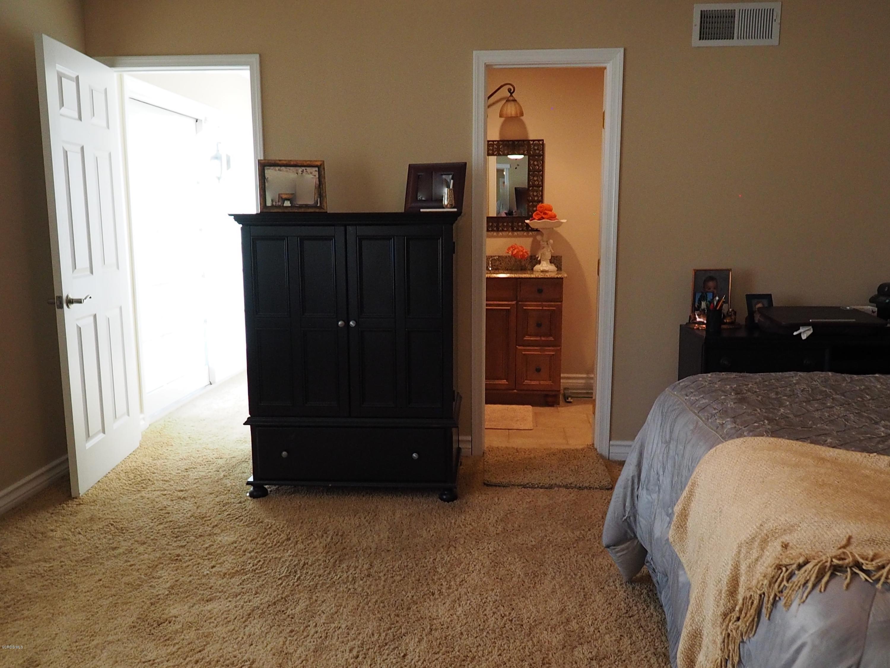 5727 Cochran Street Simi Valley, CA 93063 - Photo 34 of 43 a bedroom with a bed and a dresser