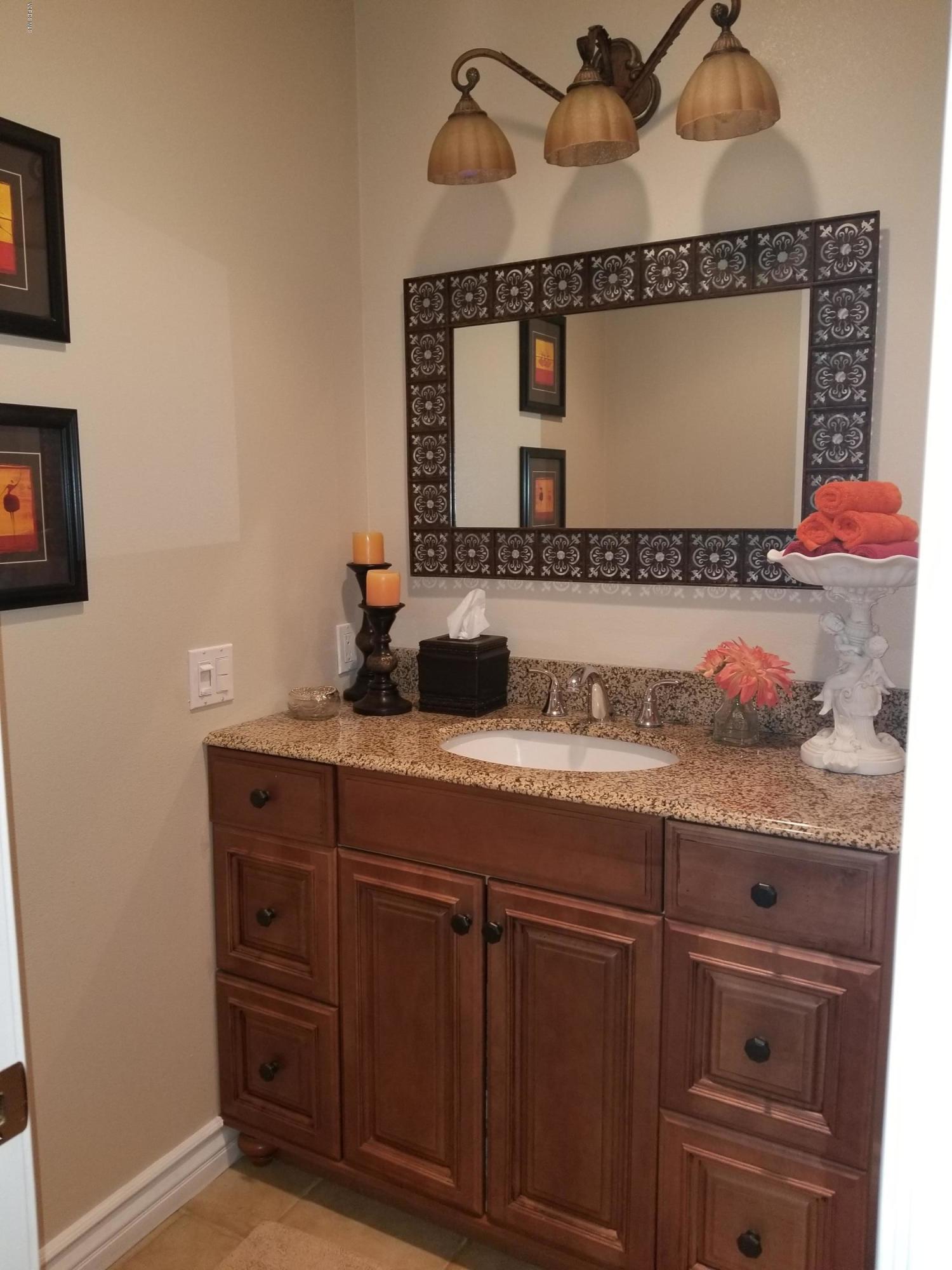 5727 Cochran Street Simi Valley, CA 93063 - Photo 35 of 43 a bathroom with a sink vanity and mirror