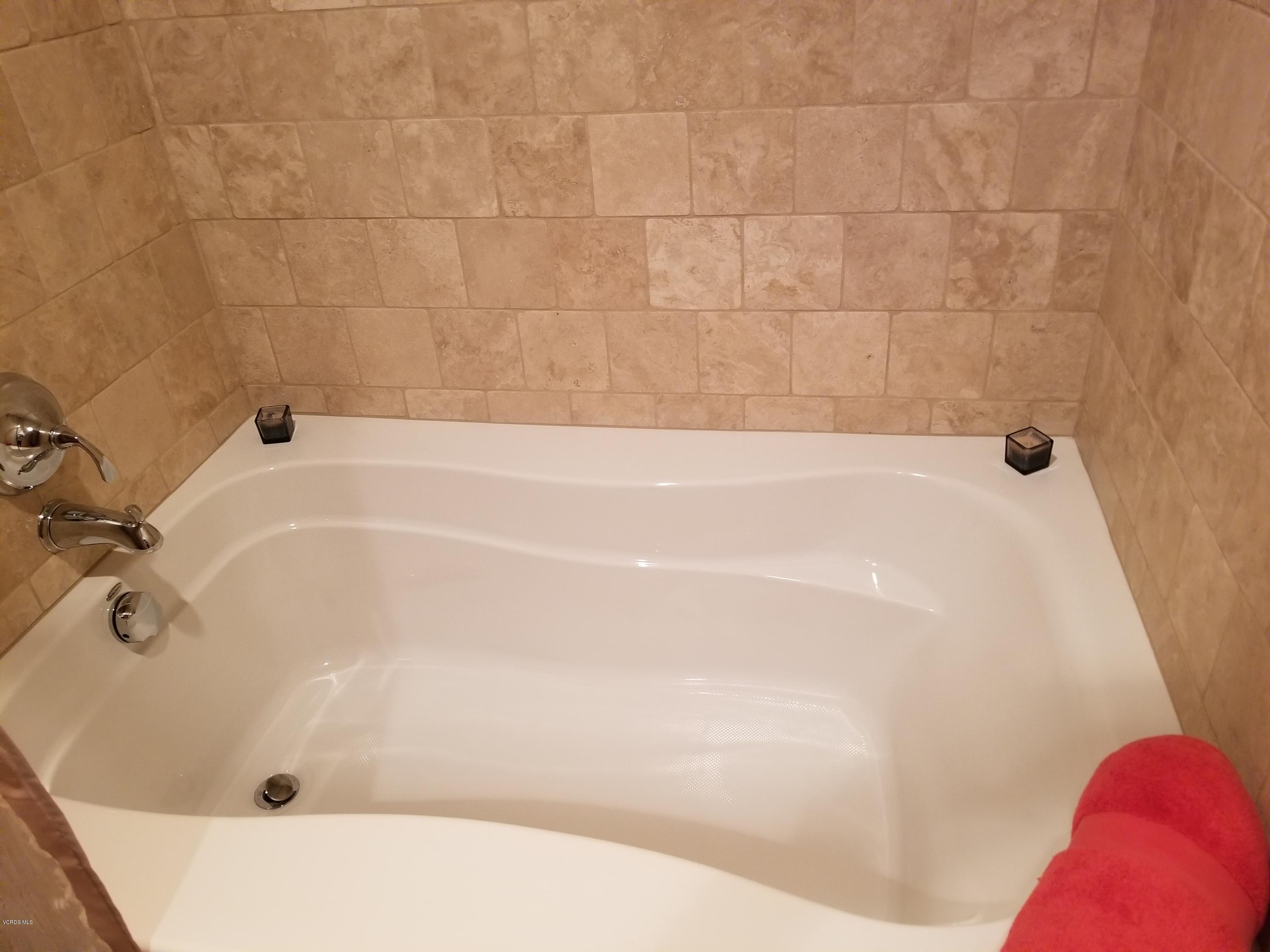 5727 Cochran Street Simi Valley, CA 93063 - Photo 38 of 43 a close up of a bathtub in a bathroom