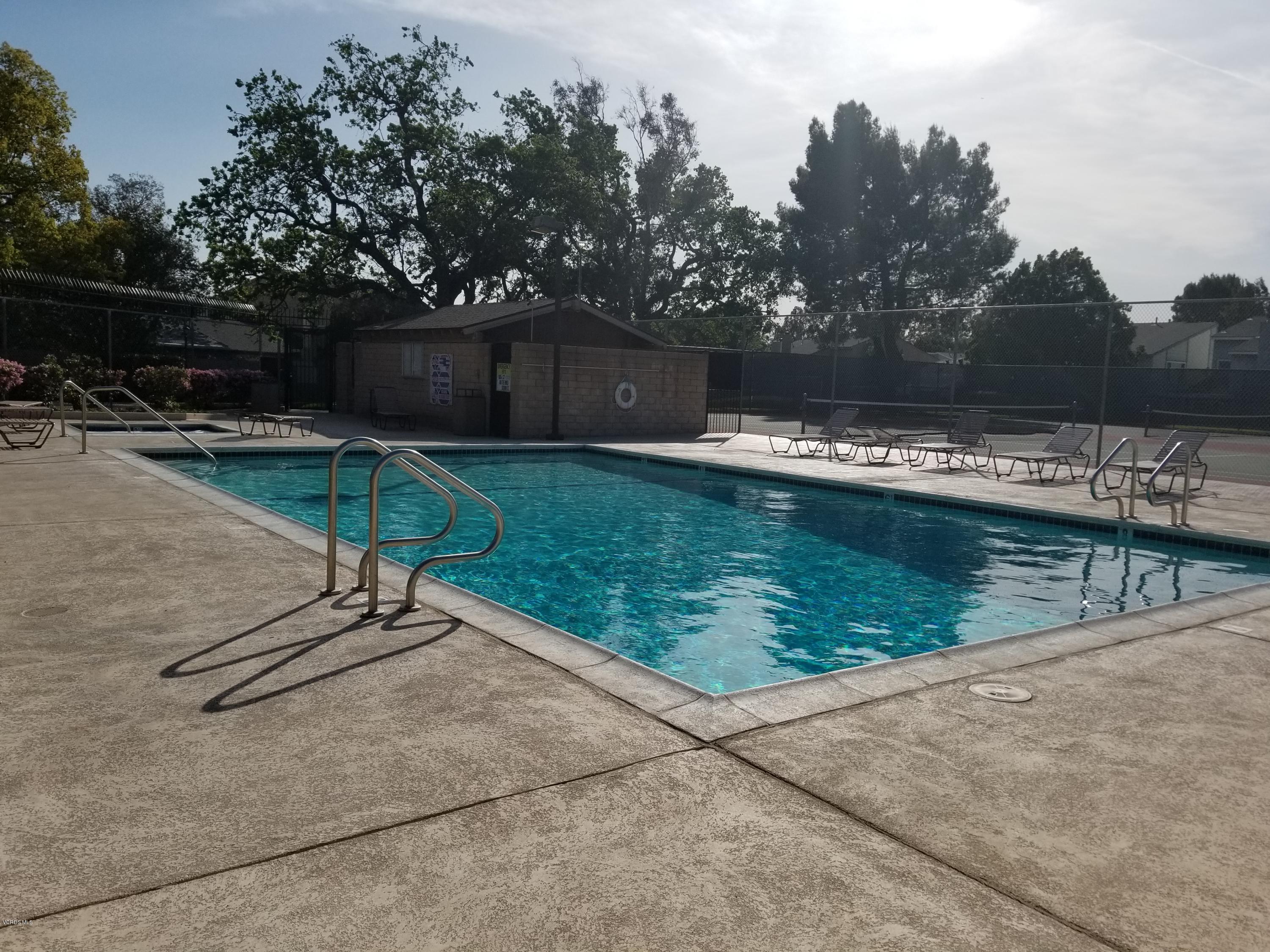 5727 Cochran Street Simi Valley, CA 93063 - Photo 42 of 43 a view of a swimming pool with a patio and a yard