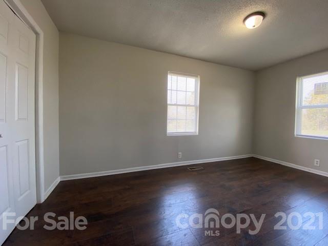 2346 Gill Jordan Road Chester, SC 29706 - Photo 20 of 30 an empty room with wooden floor and windows