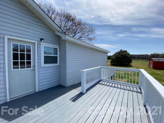 2346 Gill Jordan Road Chester, SC 29706 - Photo 24 of 30 a view of deck with wooden floor and fence with a bench