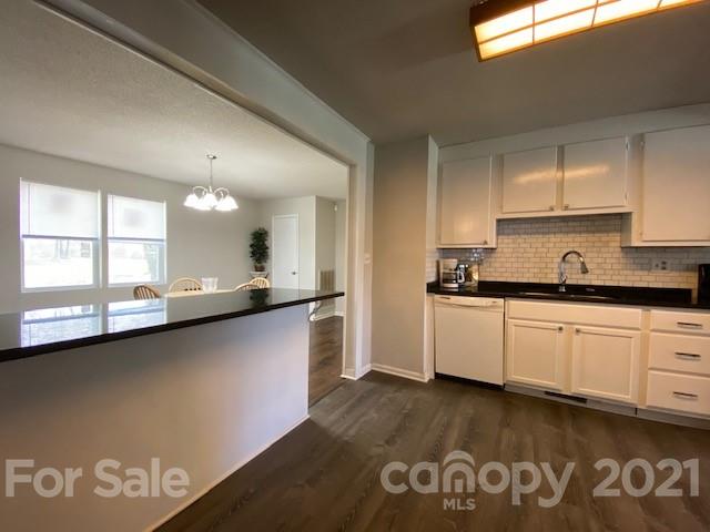 2346 Gill Jordan Road Chester, SC 29706 - Photo 10 of 30 a large kitchen with stainless steel appliances granite countertop a stove a sink and a microwave