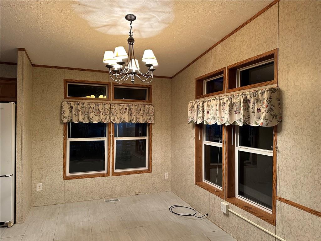 107 Trieste Street Butler, PA 16002 - Photo 11 of 40 a view of a livingroom with a chandelier