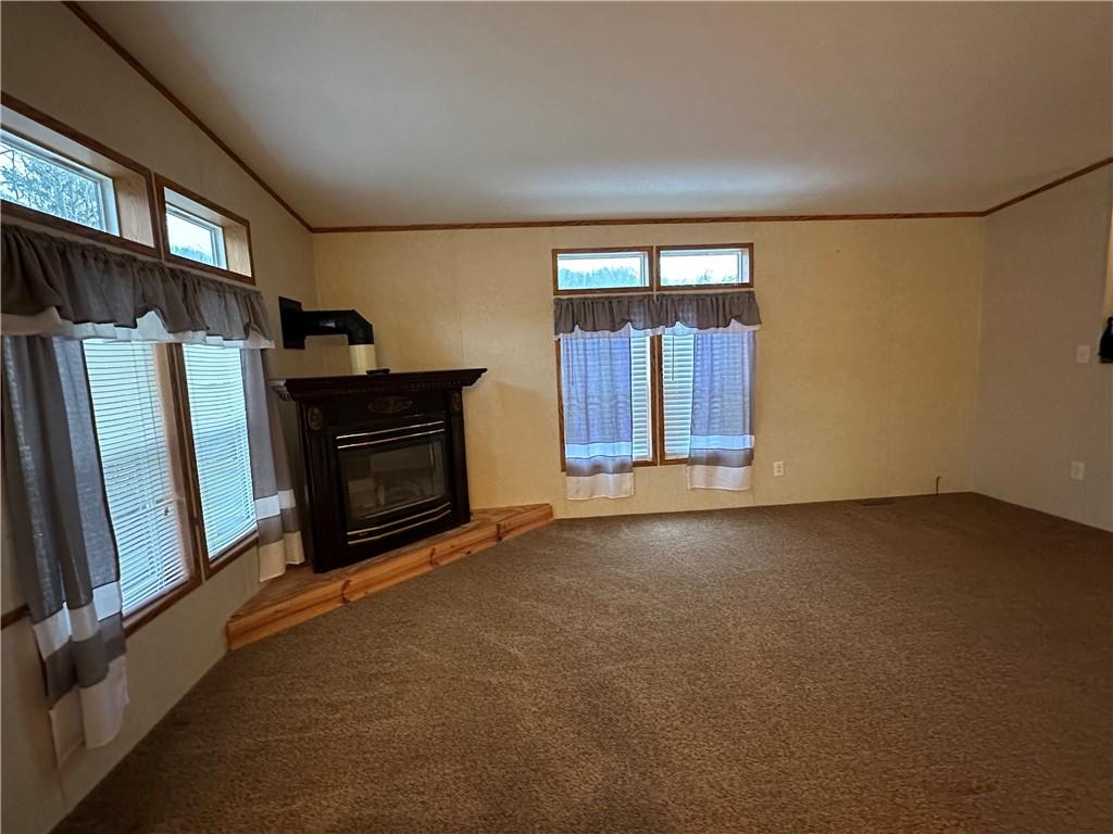 107 Trieste Street Butler, PA 16002 - Photo 14 of 40 a view of an empty room with a fireplace and a window
