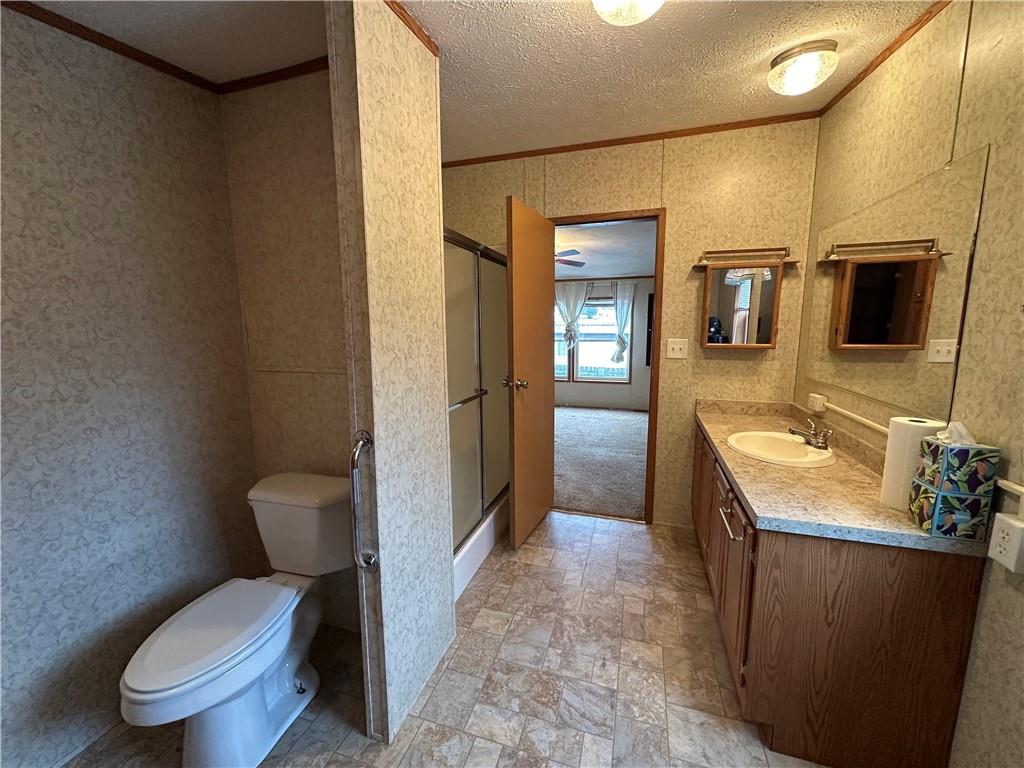 107 Trieste Street Butler, PA 16002 - Photo 22 of 40 a bathroom with a sink toilet and shower