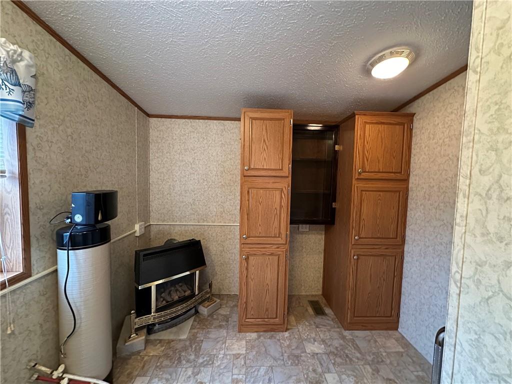 107 Trieste Street Butler, PA 16002 - Photo 23 of 40 a kitchen with a refrigerator and cabinets