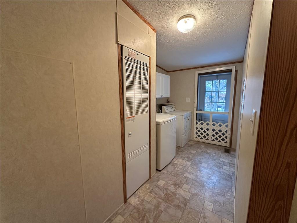 107 Trieste Street Butler, PA 16002 - Photo 27 of 40 a view of a hallway to bathroom and a sink