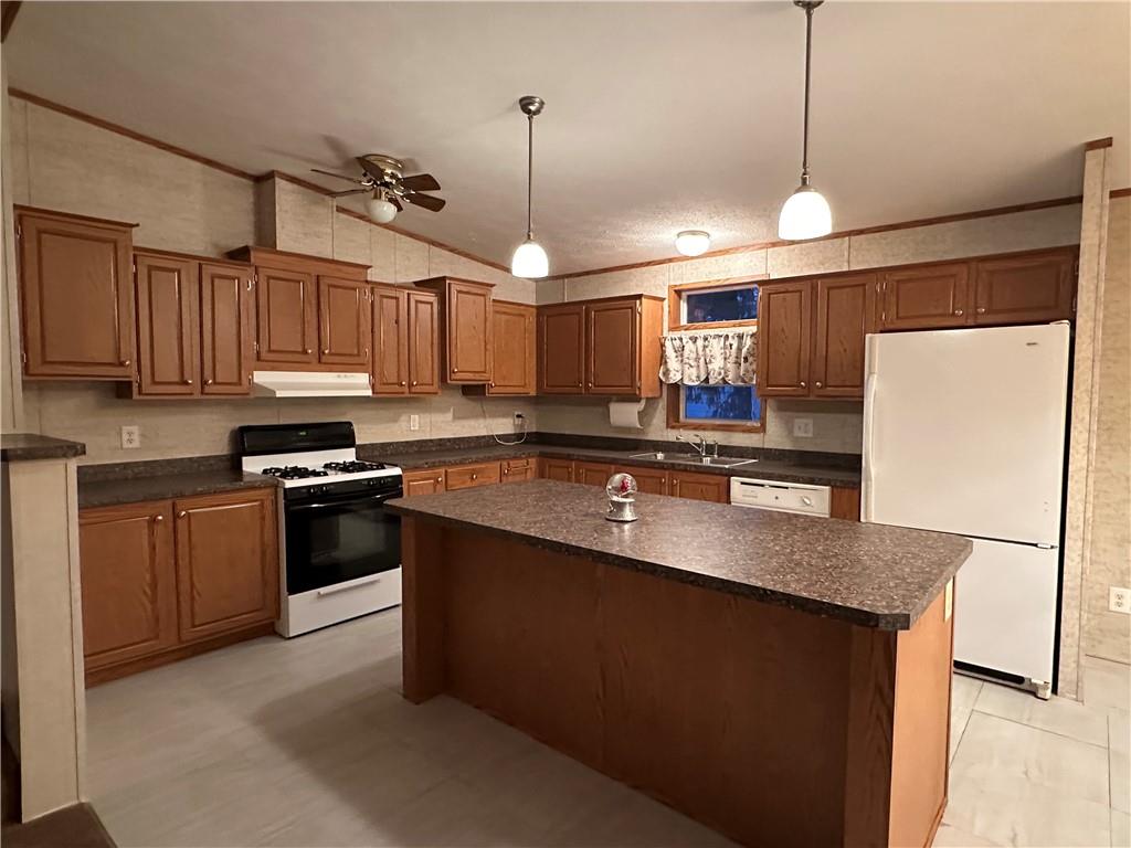 107 Trieste Street Butler, PA 16002 - Photo 3 of 40 a kitchen with stainless steel appliances granite countertop a sink a stove a refrigerator cabinets and a window