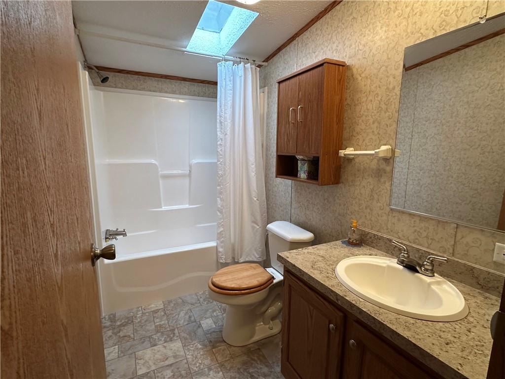 107 Trieste Street Butler, PA 16002 - Photo 36 of 40 a bathroom with a granite countertop sink toilet and shower