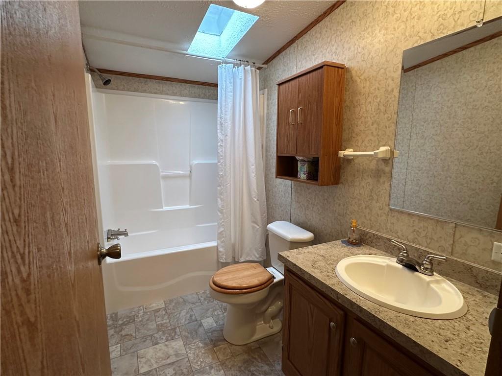 107 Trieste Street Butler, PA 16002 - Photo 37 of 40 a bathroom with a granite countertop sink toilet and shower