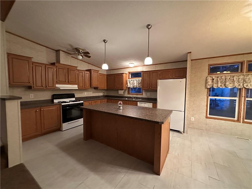 107 Trieste Street Butler, PA 16002 - Photo 4 of 40 a kitchen with stainless steel appliances granite countertop a stove and a refrigerator