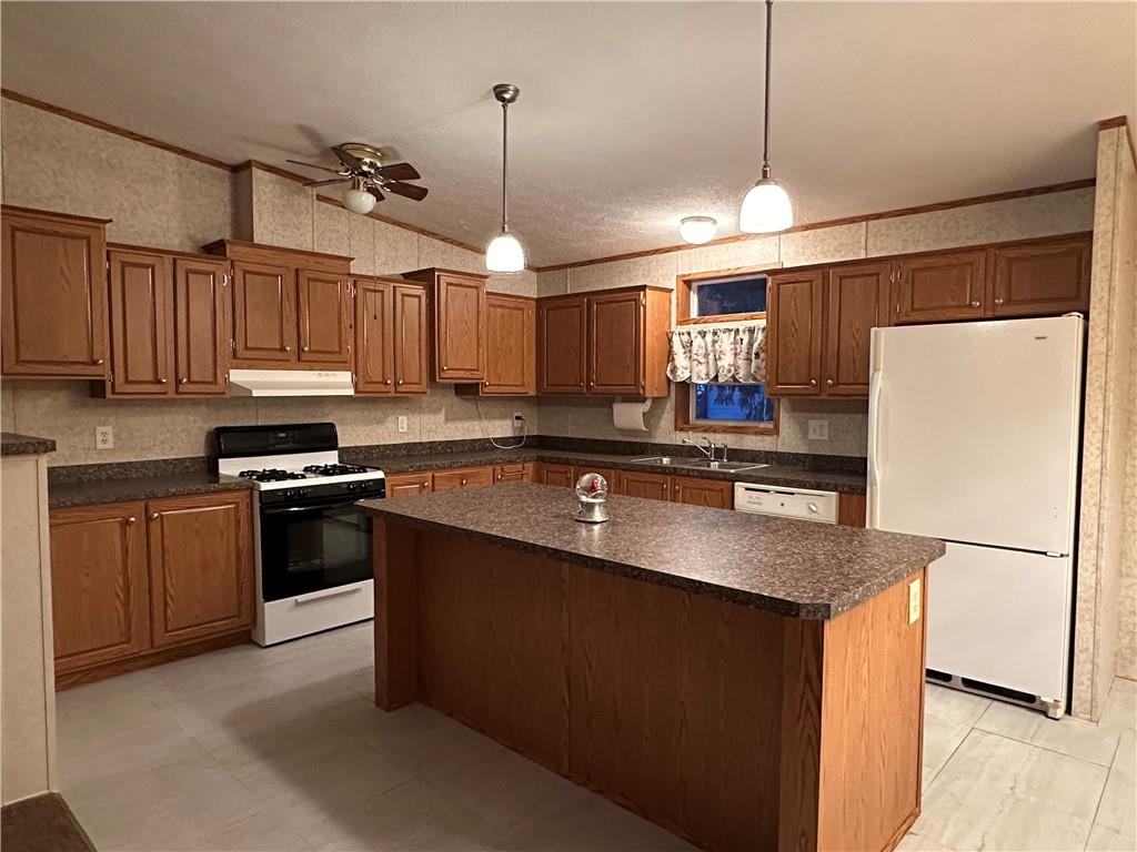 107 Trieste Street Butler, PA 16002 - Photo 5 of 40 a kitchen with stainless steel appliances granite countertop a refrigerator a sink dishwasher a stove and a refrigerator