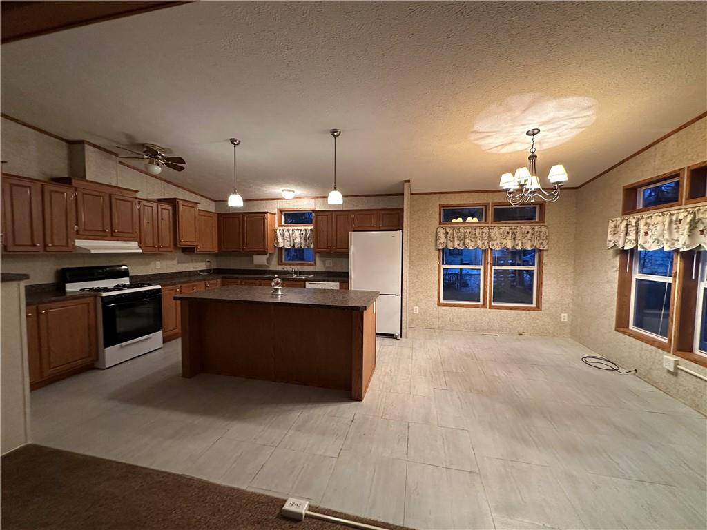 107 Trieste Street Butler, PA 16002 - Photo 6 of 40 a large kitchen with cabinets and stainless steel appliances