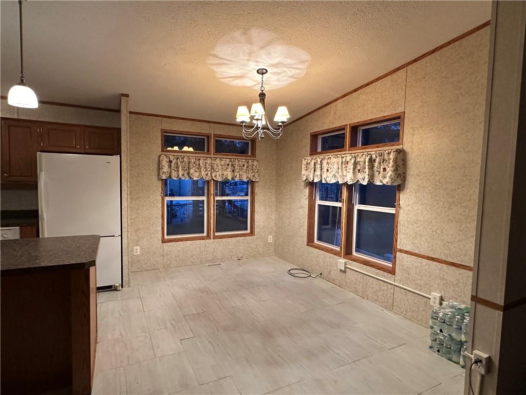 107 Trieste Street Butler, PA 16002 - Photo 8 of 40 a view of an empty room with a window and fireplace