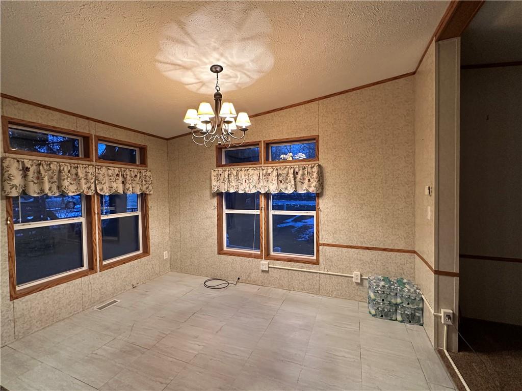 107 Trieste Street Butler, PA 16002 - Photo 9 of 40 a view of a chandelier and fire place
