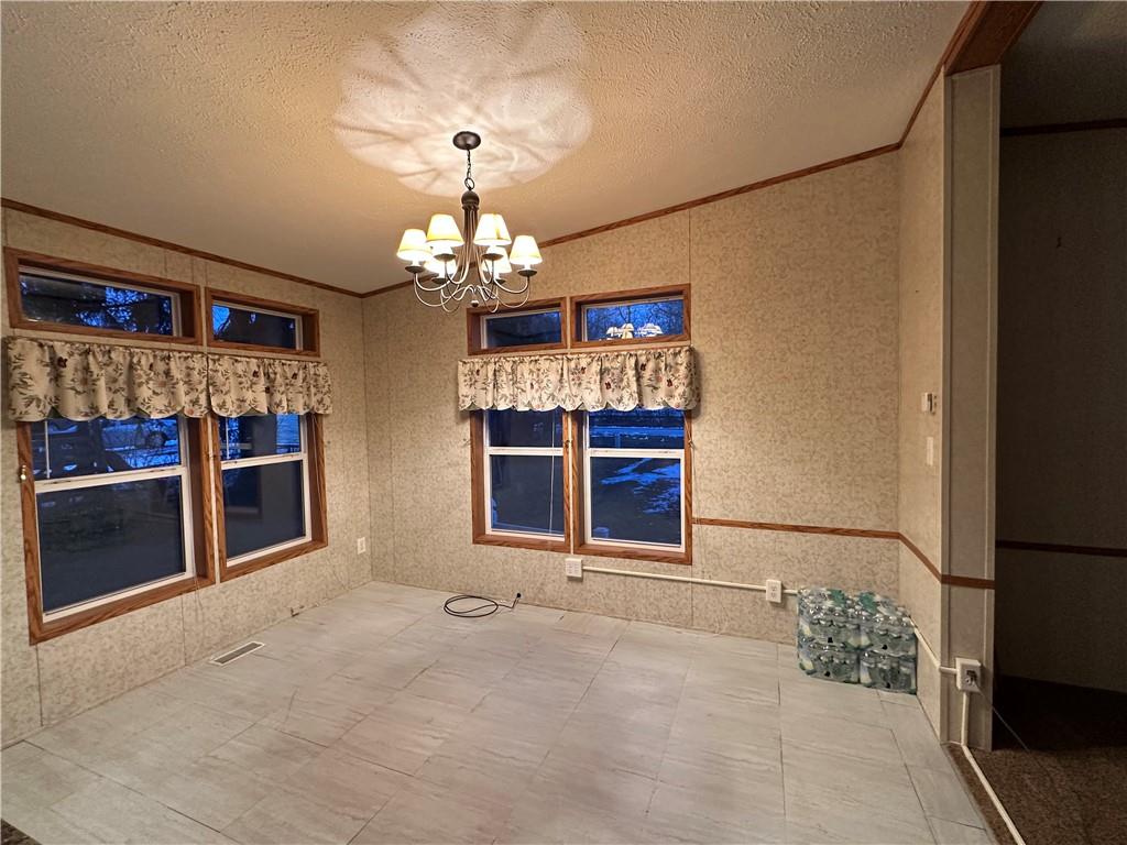 107 Trieste Street Butler, PA 16002 - Photo 10 of 40 a view of a livingroom with a chandelier