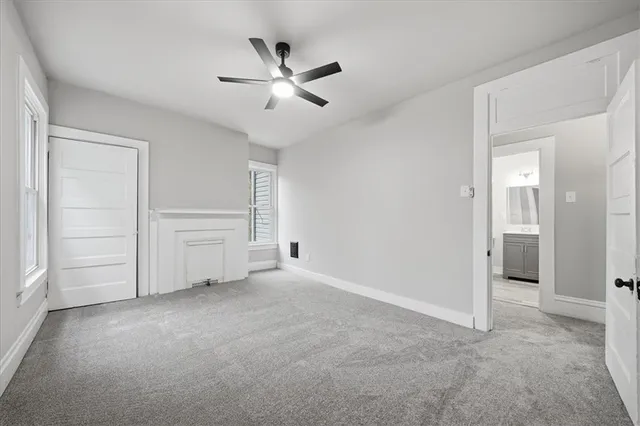 a view of an empty room and closet area