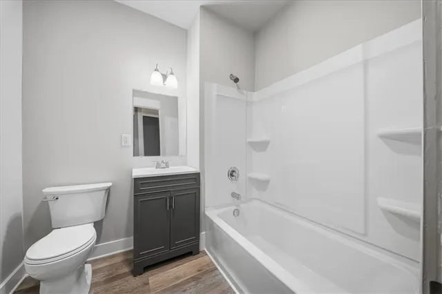 a bathroom with a toilet sink and bathtub