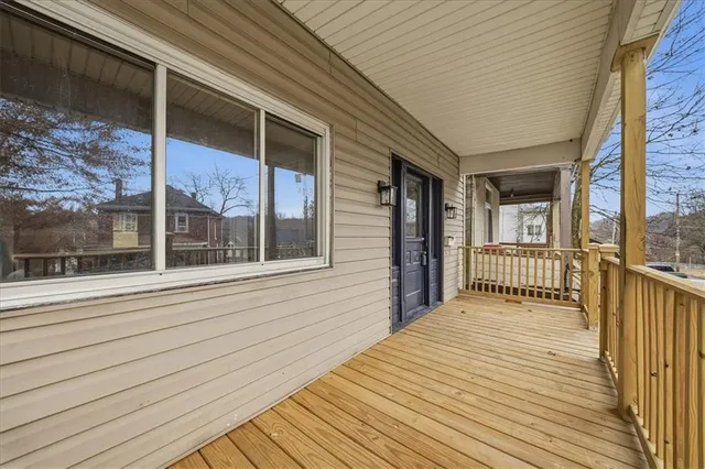a view of backyard with a balcony