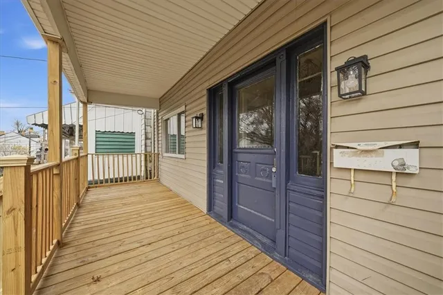 a porch with wooden floor